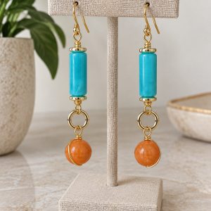 Pendientes largos con detalles turquesas